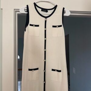 Elegant Cream Sleeveless Dress with Black Trim